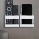 Wall mounted mobile phone holder